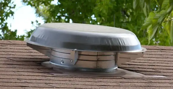 attic fan installation services with low-profile roof ventilation unit in Bloomington, IN