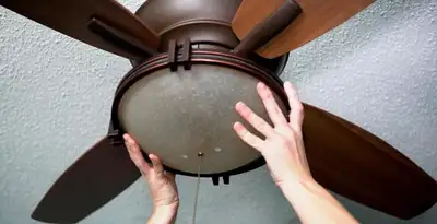 Ceiling fan repair and reinstallation on ceiling mount in Bloomington, IN