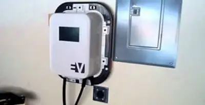 Electric car charger installation with wall-mounted EV charging station in Bloomington, IN