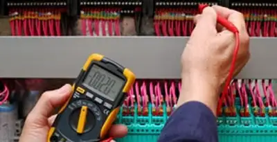 electrical service showing professional testing and troubleshooting of electrical panel by licensed electricians in Bloomington, IN