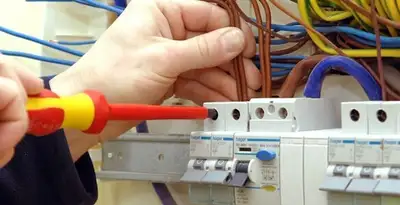 electrician services performing professional electrical panel wiring and connections in Bloomington, IN