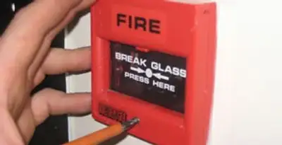 fire alarm installation service showing manual fire alarm pull station installed by licensed electricians in Bloomington, IN