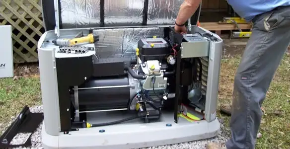 generator installation service showing technician connecting and configuring generator components in Bloomington, IN