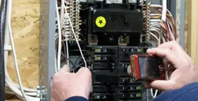 Home electrical inspection of circuit breaker panel by licensed electrician in Bloomington, IN