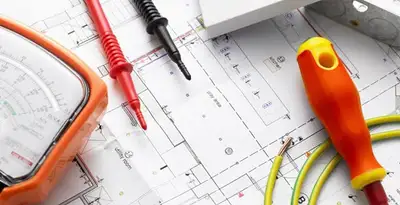 licensed electrician planning and testing electrical systems using professional tools in Bloomington, IN