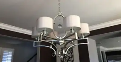 Modern chandelier installation with multiple light fixtures in Bloomington, IN