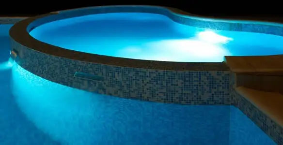 pool light installation and repair services highlighting illuminated pool interior lighting in Bloomington, IN