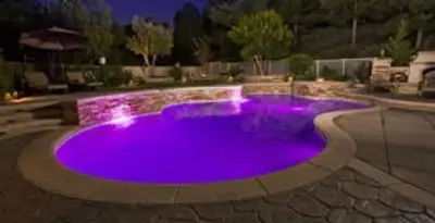 pool light installation and repair services illuminating a residential swimming pool in Bloomington, IN
