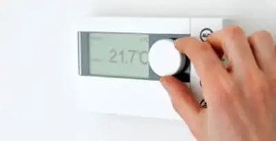 Thermostat installation service with professional adjusting temperature control in Bloomington, IN