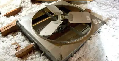 whole house fan installation services with attic-mounted ventilation unit in Bloomington, IN